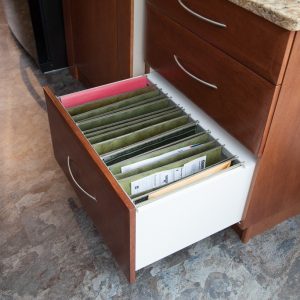 Filing drawer. Instead of piling them on a desk put them in one of these!