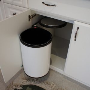 Swing out garbage with self closing lid. 20 Liter Capacity.